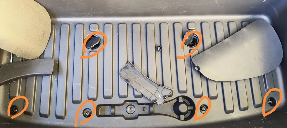 Six front boot liner screw positions circled in orange, including two beneath circular covers
