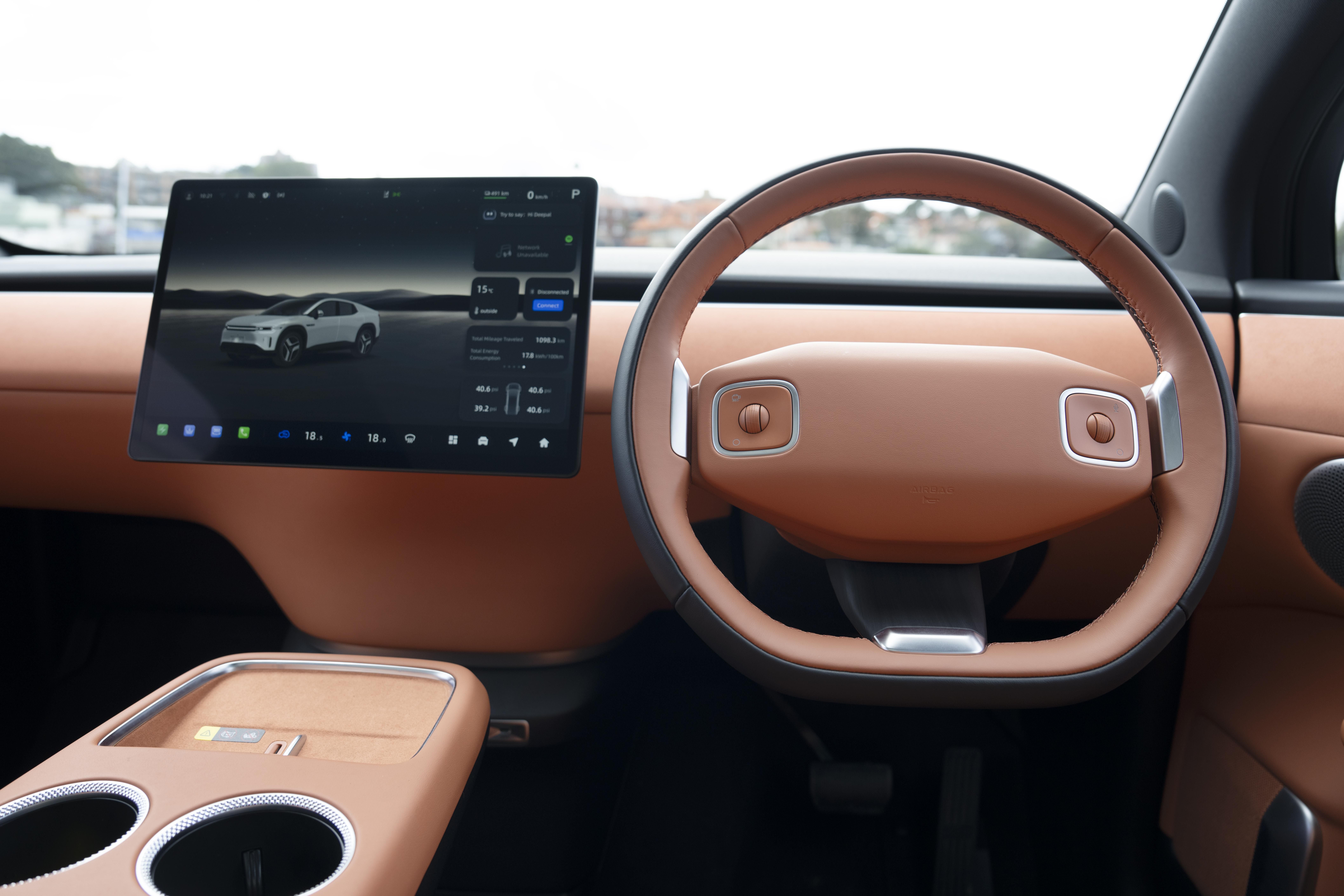 The Deepal E07’s steering wheel, centre screen and tan interior