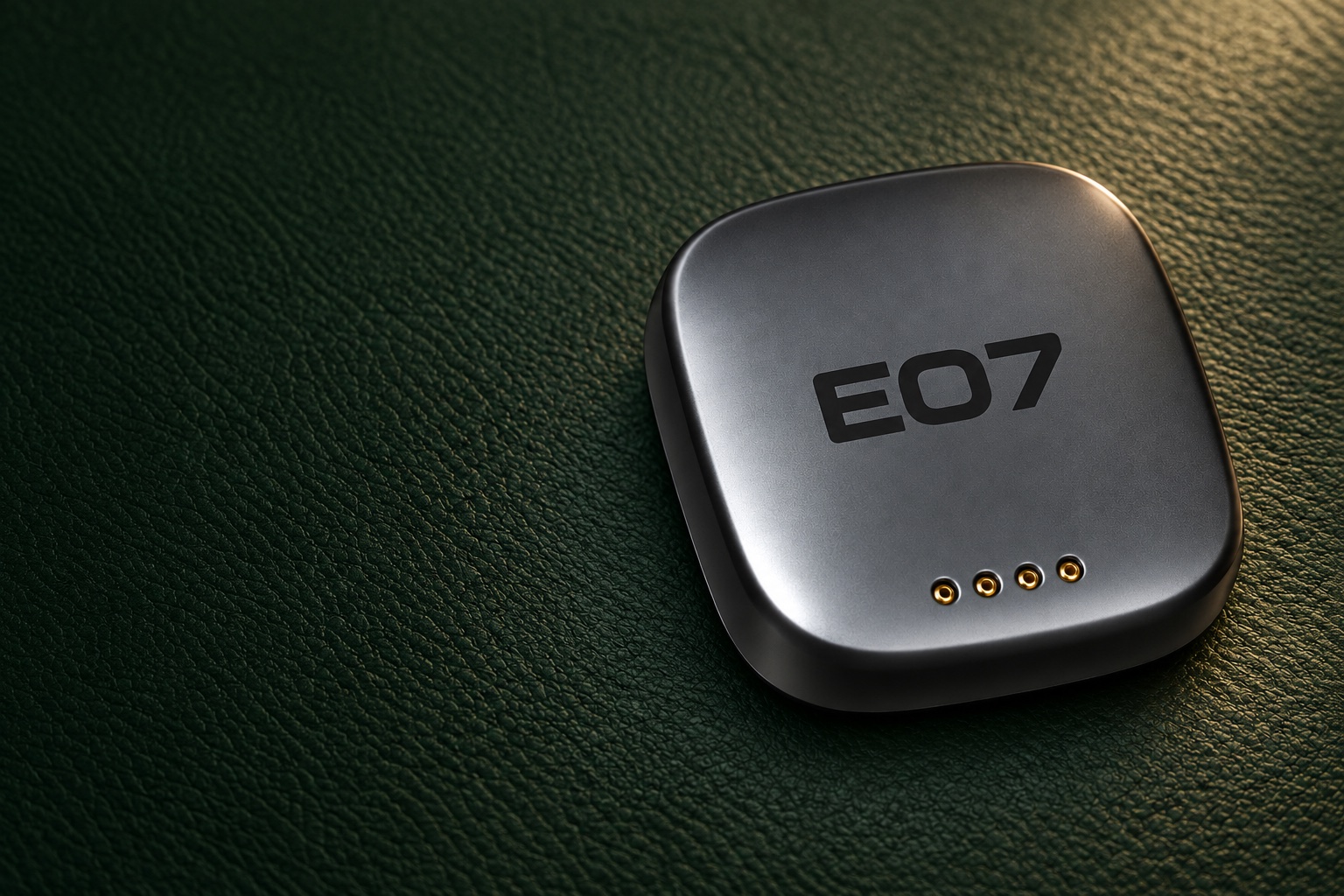 Enhanced image of the supplied rounded-square graphite E07 smart key, with E07 lettering and four gold contacts